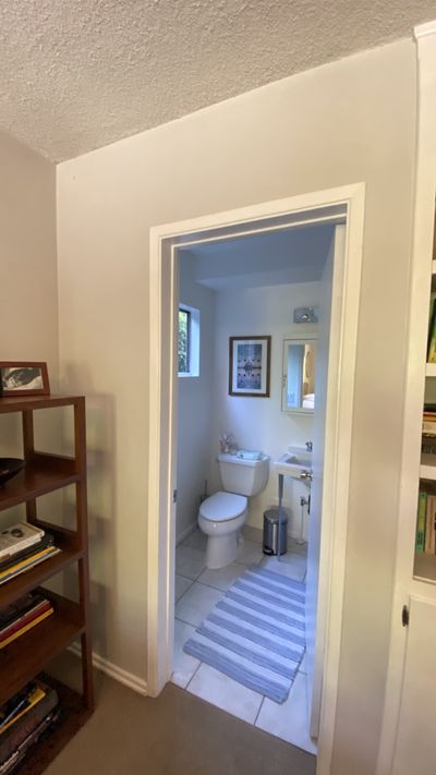 View from the hallway showing the completed bathroom