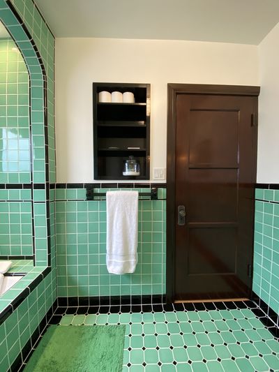 Restored three-panel wood door and built-in niche detail