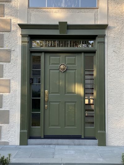 Custom sage green front door with pilasters sidelights and brass knocker Montgomery County PA — Fred Beese Builds