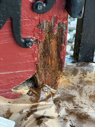 Closeup of severe rot damage at door rail and hinge — Fort Washington PA