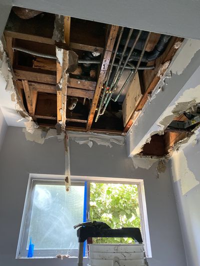 Before: Exposed studs with water damage