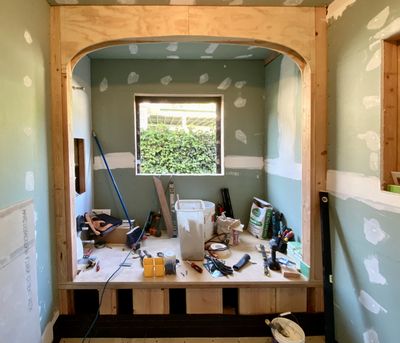 Arched alcove framing for custom tub surround — bathroom renovation